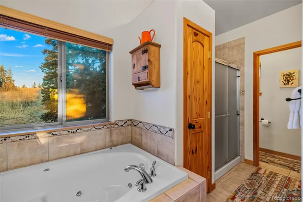 a bathroom with a tub and a shower