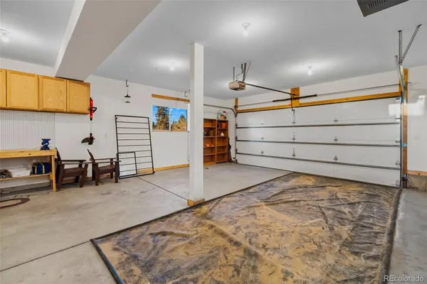a view of a room with furniture and windows