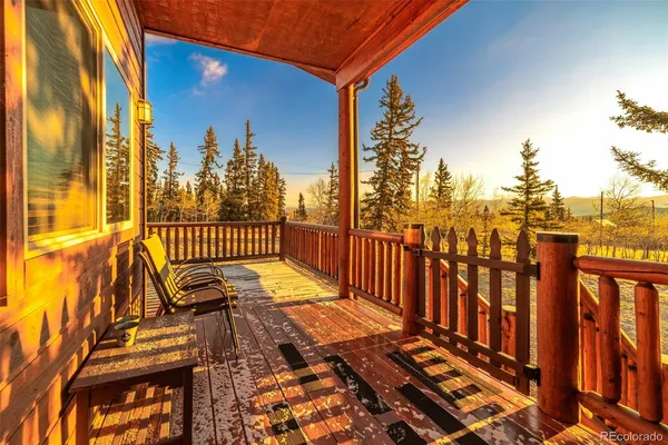 a view of a balcony with chairs