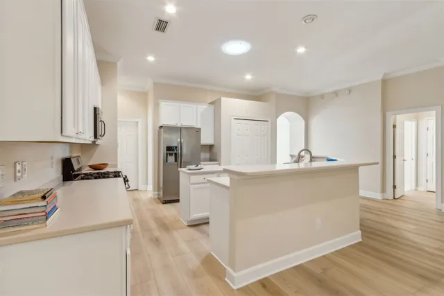 a view of a room with wooden floor and a window