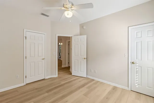 a bathroom with a sink a toilet a mirror and shower