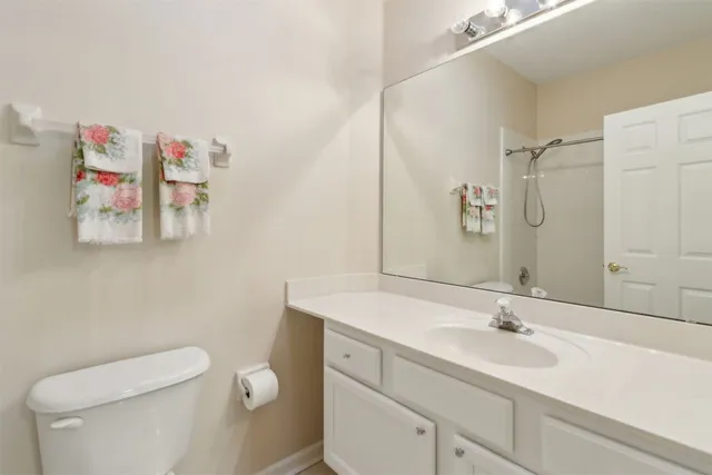 a white toilet sitting next to a bath tub and shower
