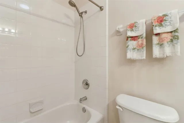 a view of a room with windows and balcony