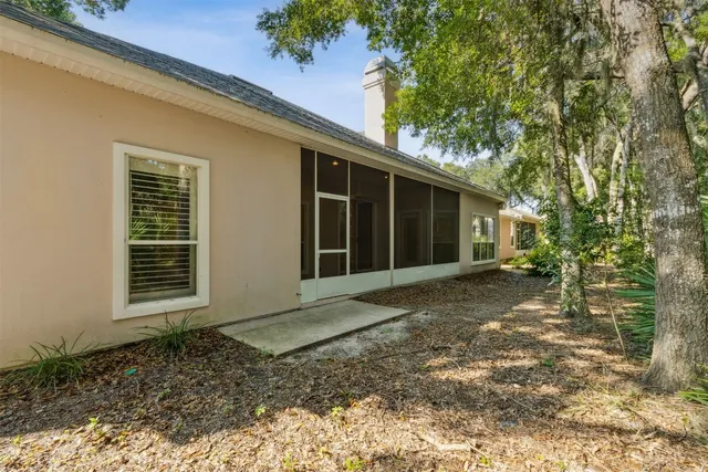 an aerial view of a houses with a yard