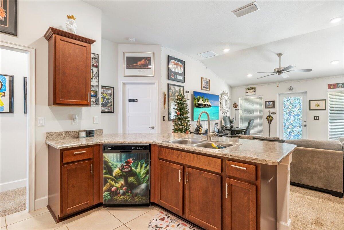 5348 Vespera Street Fort Pierce, FL 34951 - Photo 18 of 39 a kitchen with a sink stove and cabinets