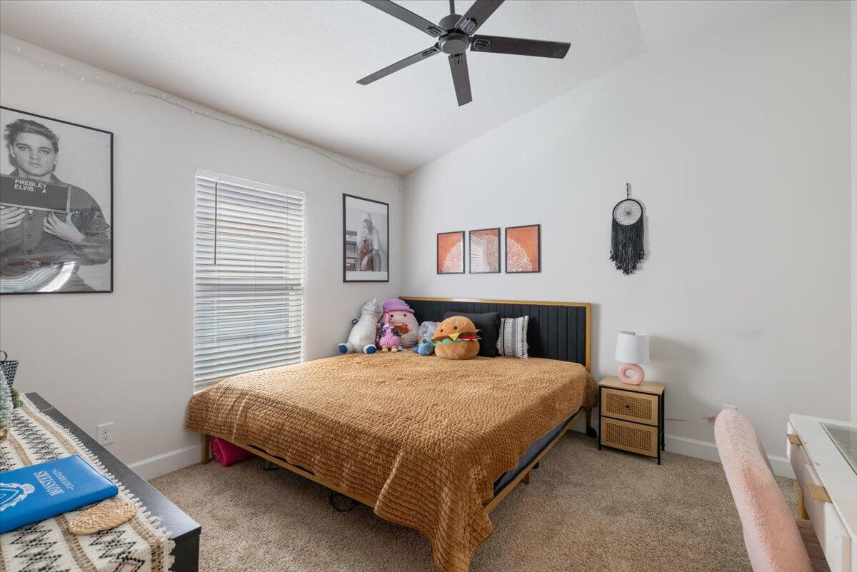 5348 Vespera Street Fort Pierce, FL 34951 - Photo 25 of 39 a bedroom with a bed a window and closet