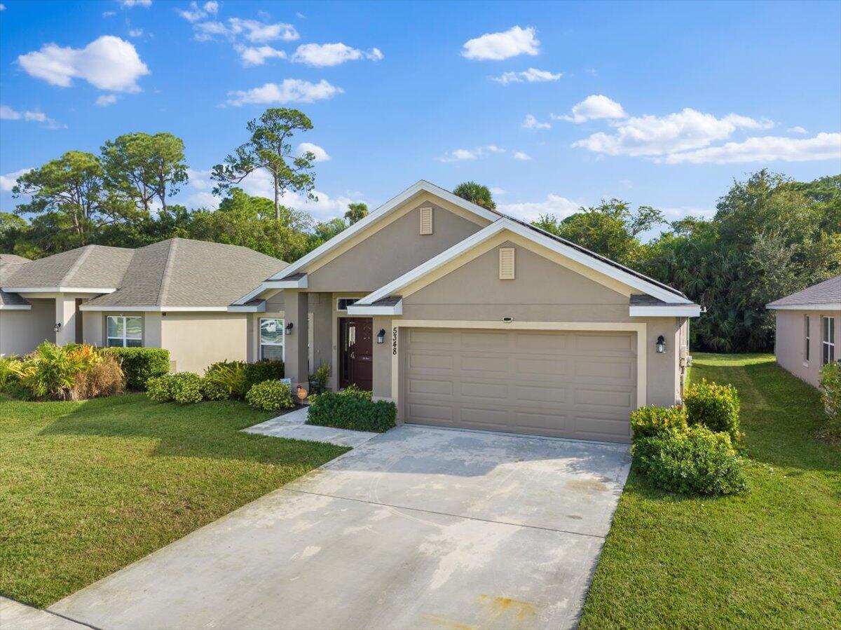 5348 Vespera Street Fort Pierce, FL 34951 - Photo 37 of 39 a front view of house with yard and green space