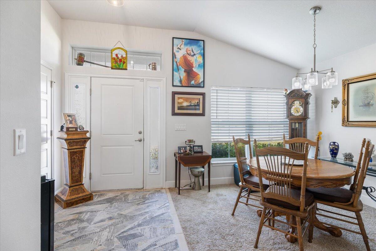 5348 Vespera Street Fort Pierce, FL 34951 - Photo 6 of 39 a view of a dining room with furniture and chandelier