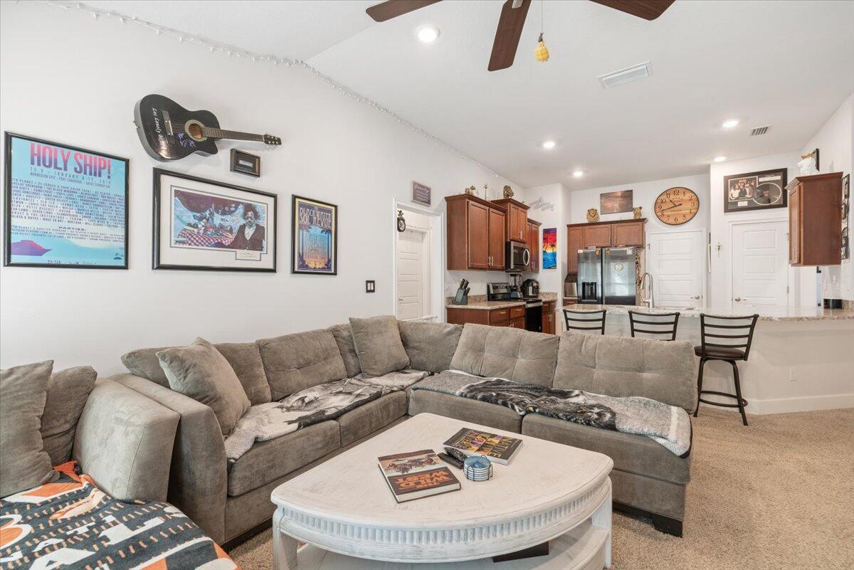 5348 Vespera Street Fort Pierce, FL 34951 - Photo 10 of 39 a living room with furniture and a chandelier