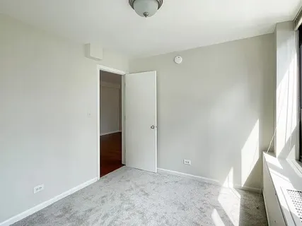 a view of an empty room and window