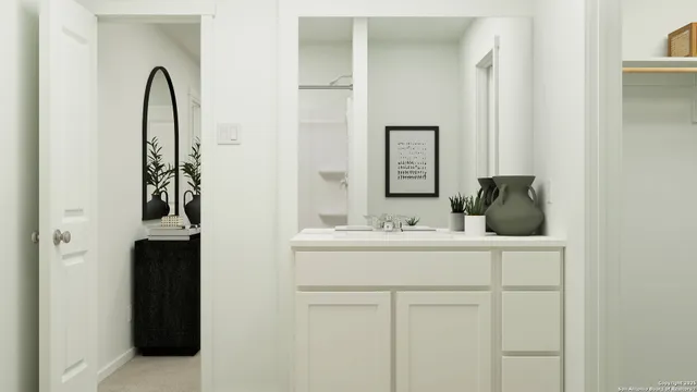 a bathroom with a sink and a mirror