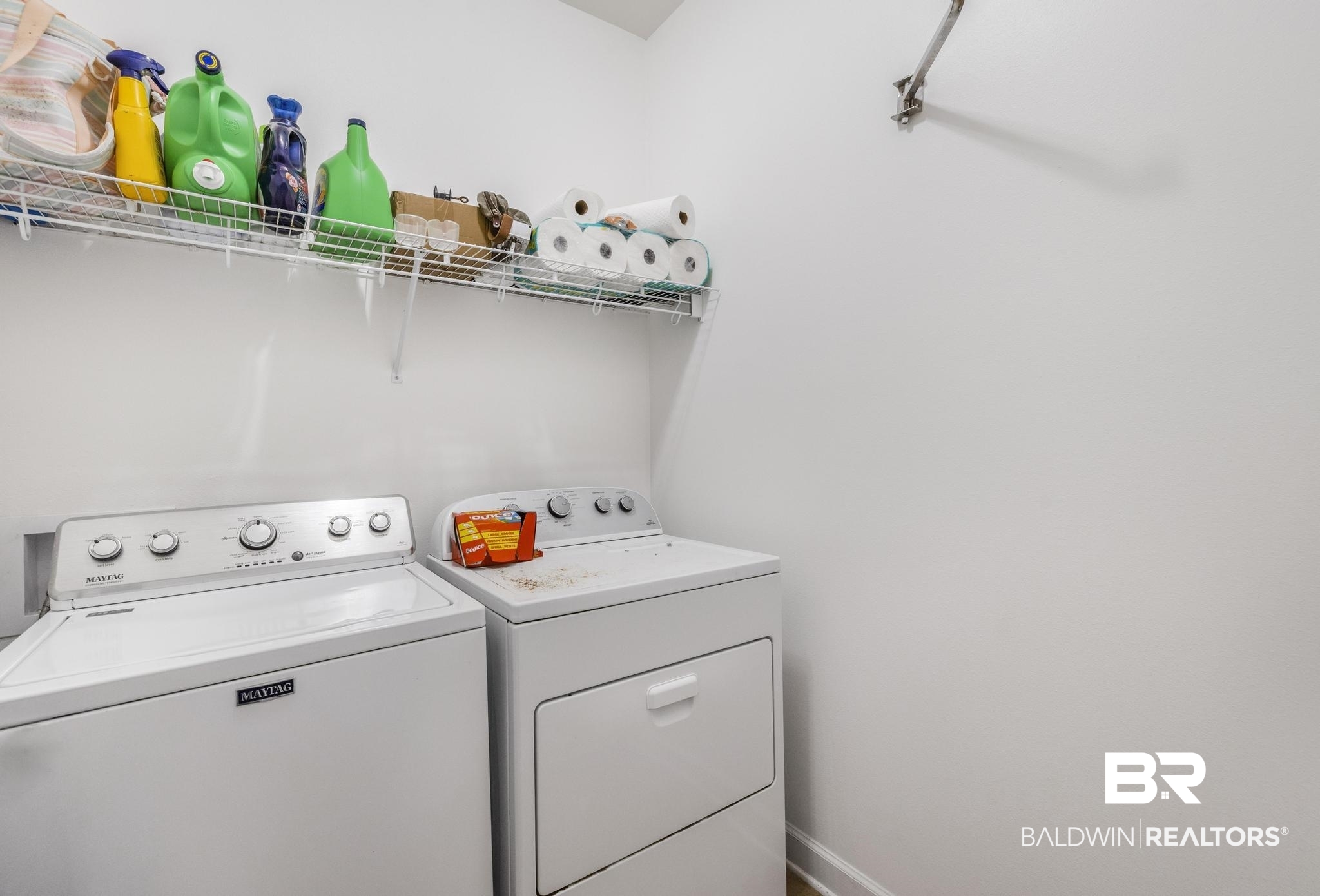 35814 Delvan Lane Bay Minette, AL 36507 - Photo 32 of 53 Dedicated laundry area featuring white walls, wire shelving, and a wall-mounted drying rack