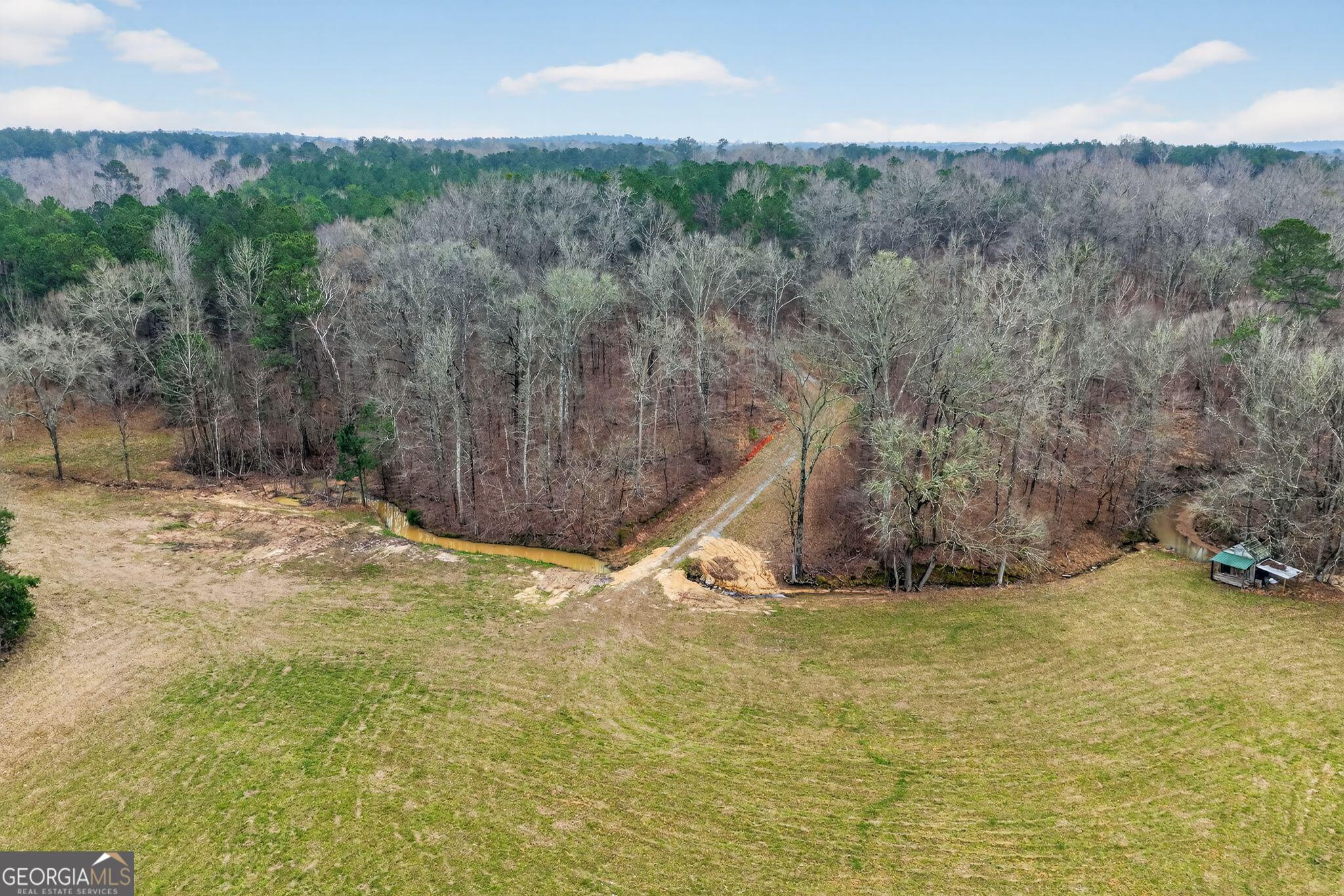 119 Hough Johnson Road Haddock, GA 31033 - Photo 19 of 36 a view of a yard with wooden fence