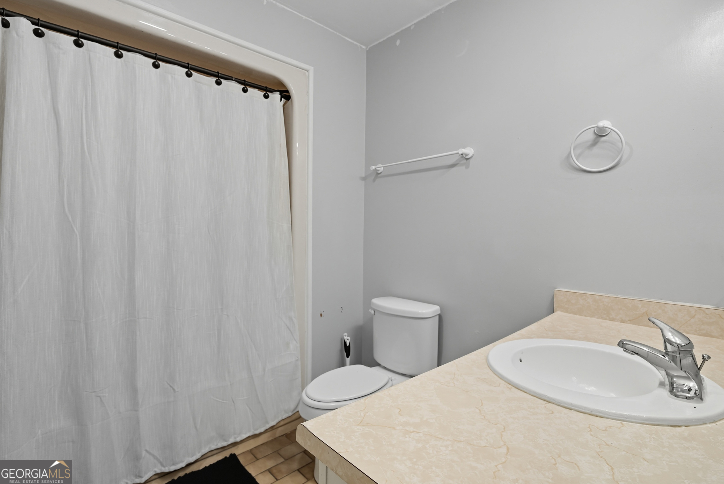 757 Old Screven Road Jesup, GA 31545 - Photo 19 of 38 a white toilet sitting next to a white sink