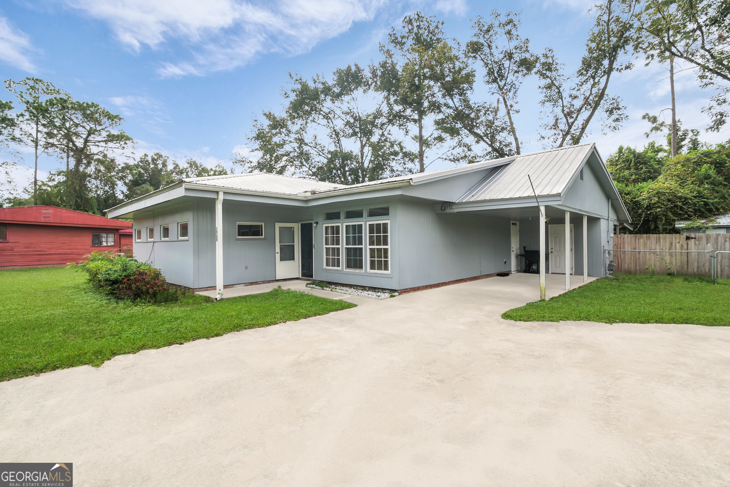 757 Old Screven Road Jesup, GA 31545 - Photo 3 of 38 a front view of a house with a yard and garage