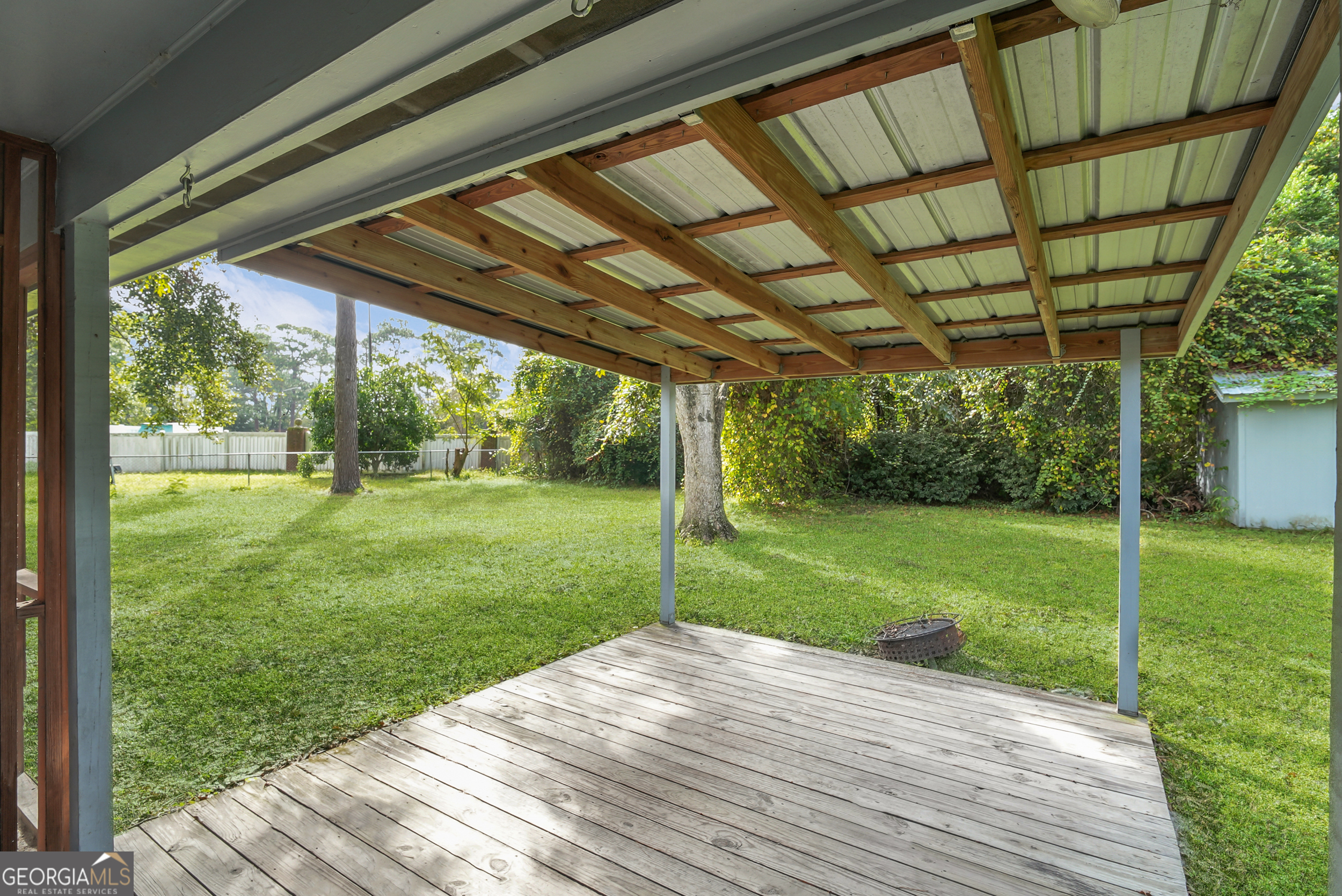 757 Old Screven Road Jesup, GA 31545 - Photo 32 of 38 a view of a backyard with wooden floor and a backyard