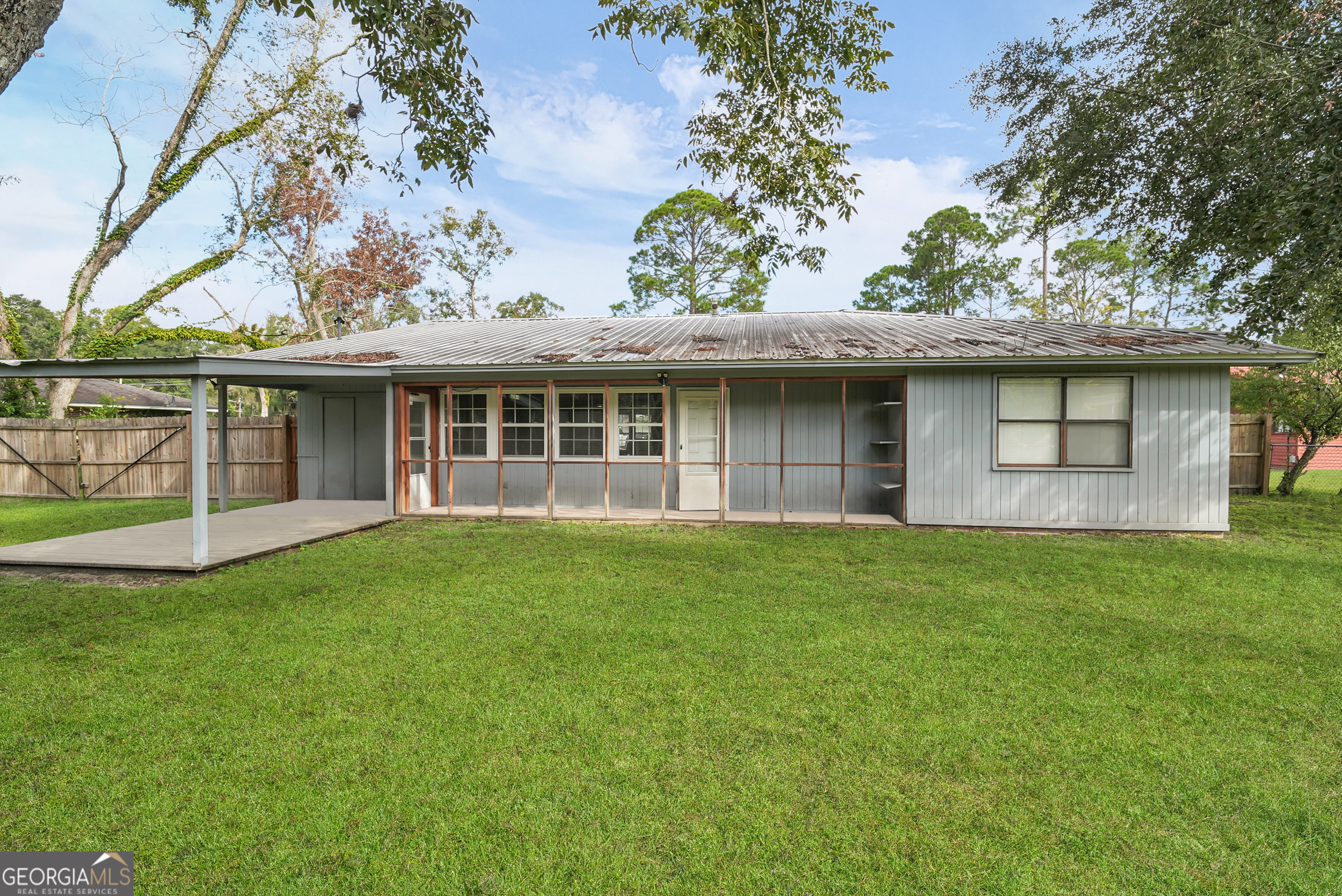 757 Old Screven Road Jesup, GA 31545 - Photo 33 of 38 a view of a house with a garden