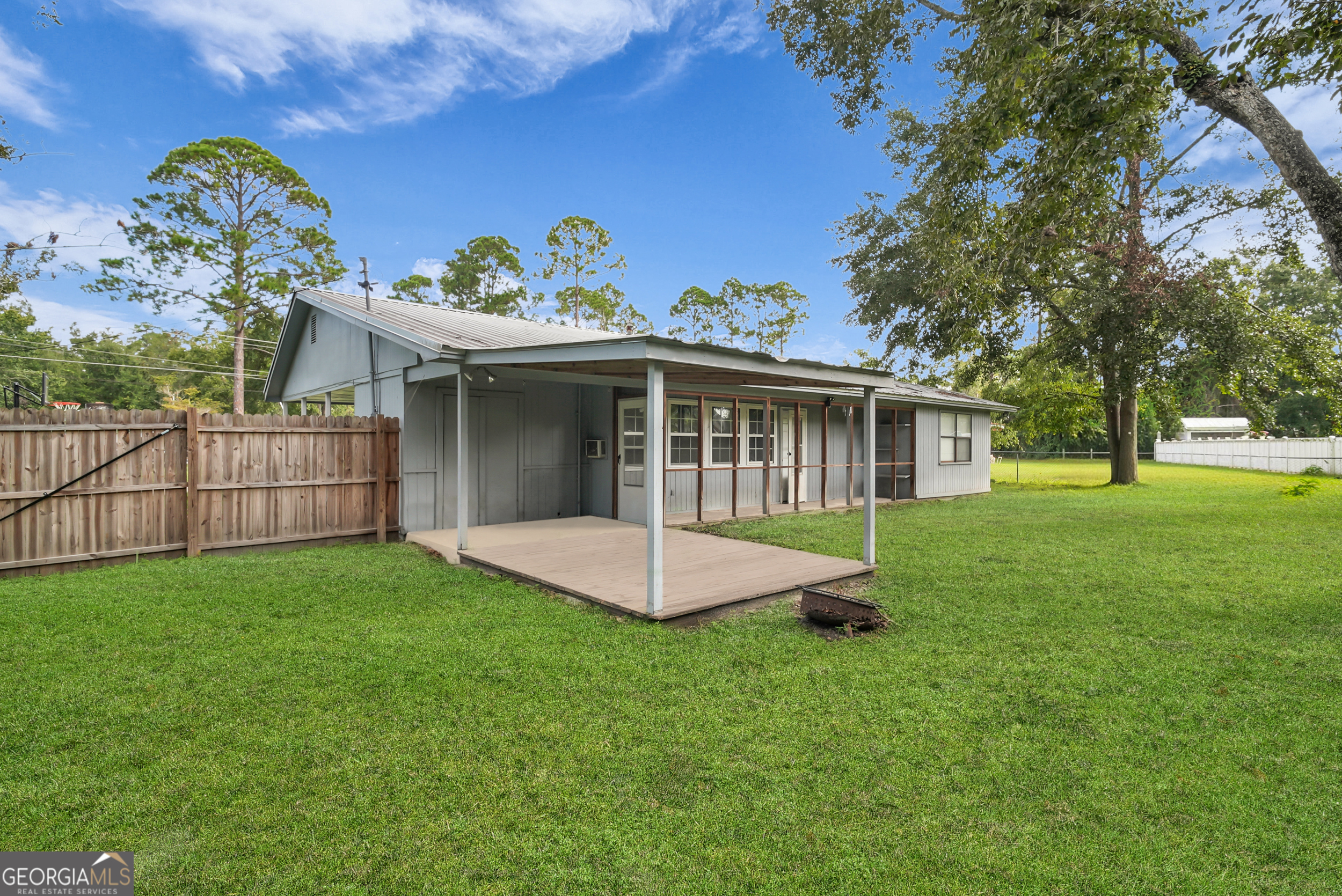 757 Old Screven Road Jesup, GA 31545 - Photo 34 of 38 a view of a house with a yard and a garden