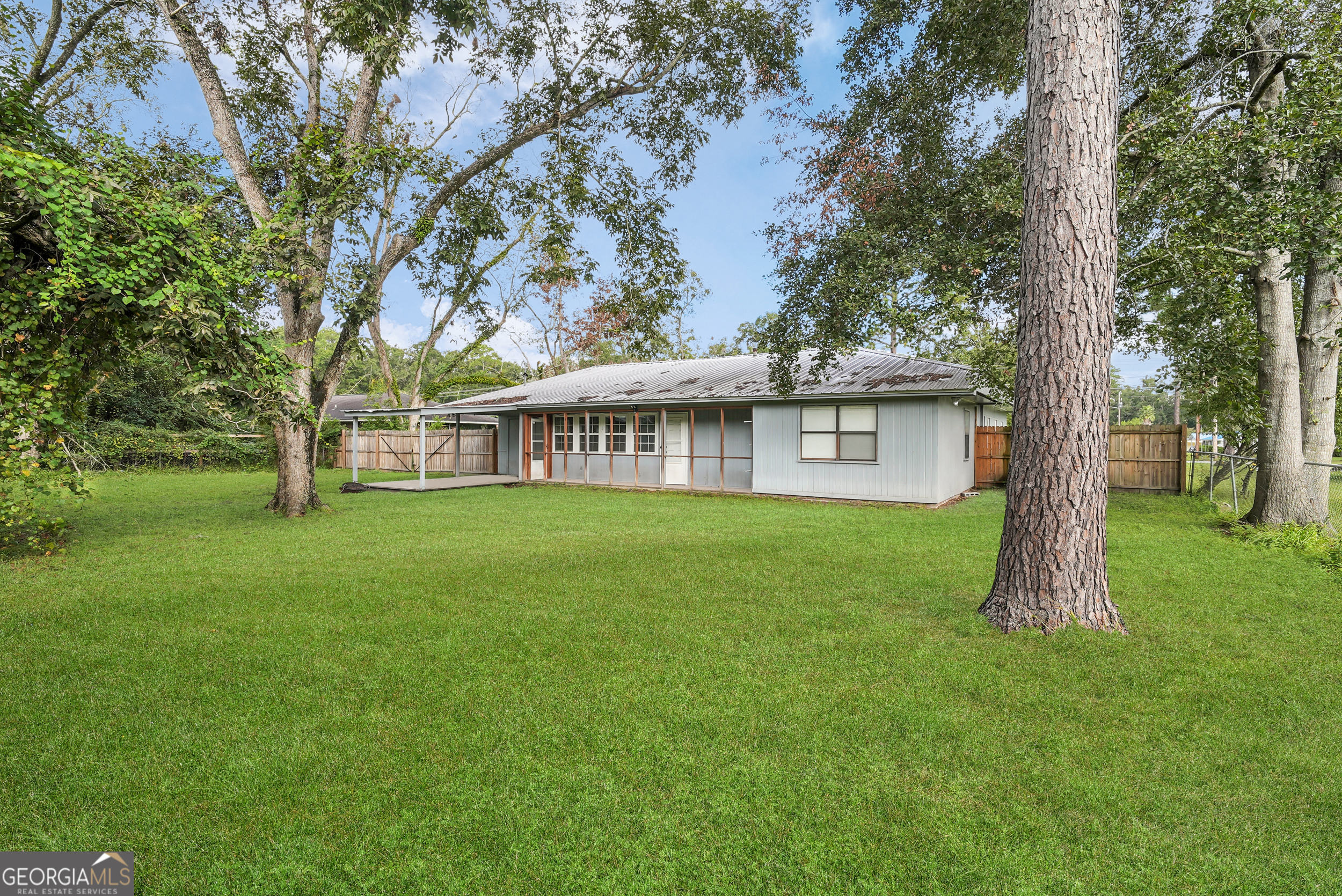 757 Old Screven Road Jesup, GA 31545 - Photo 35 of 38 a view of a house with a yard and tree