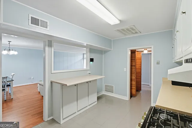 a view of kitchen with furniture and wooden floor