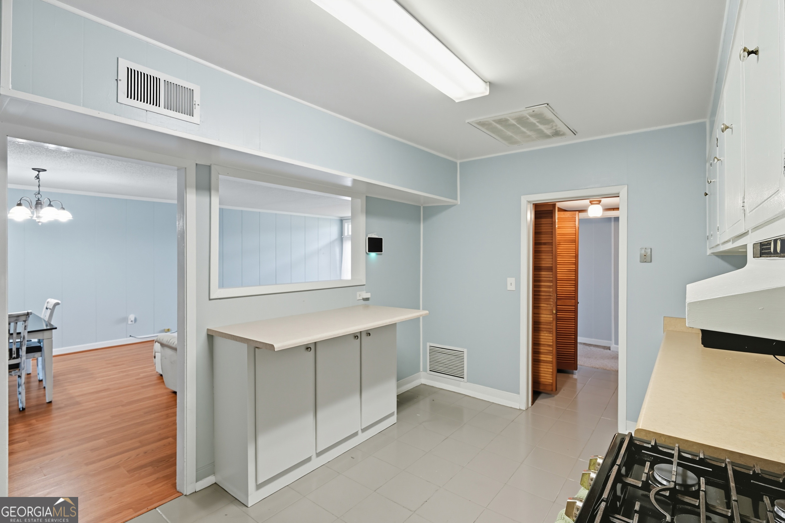 757 Old Screven Road Jesup, GA 31545 - Photo 9 of 38 a view of kitchen with furniture and wooden floor