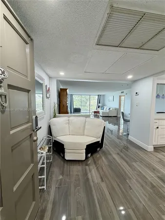 a kitchen with cabinets and window