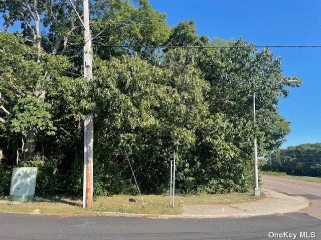 a street sign next to a road