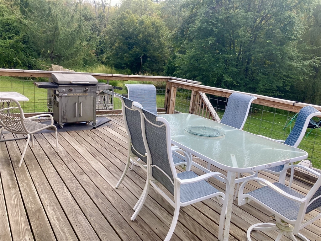 6 Kimball Hill Road Holland, MA 01521 - Photo 15 of 19 a view of a chairs and table on the roof deck