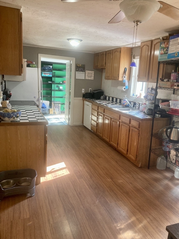 6 Kimball Hill Road Holland, MA 01521 - Photo 4 of 19 a kitchen with granite countertop a stove a sink and a wooden cabinets