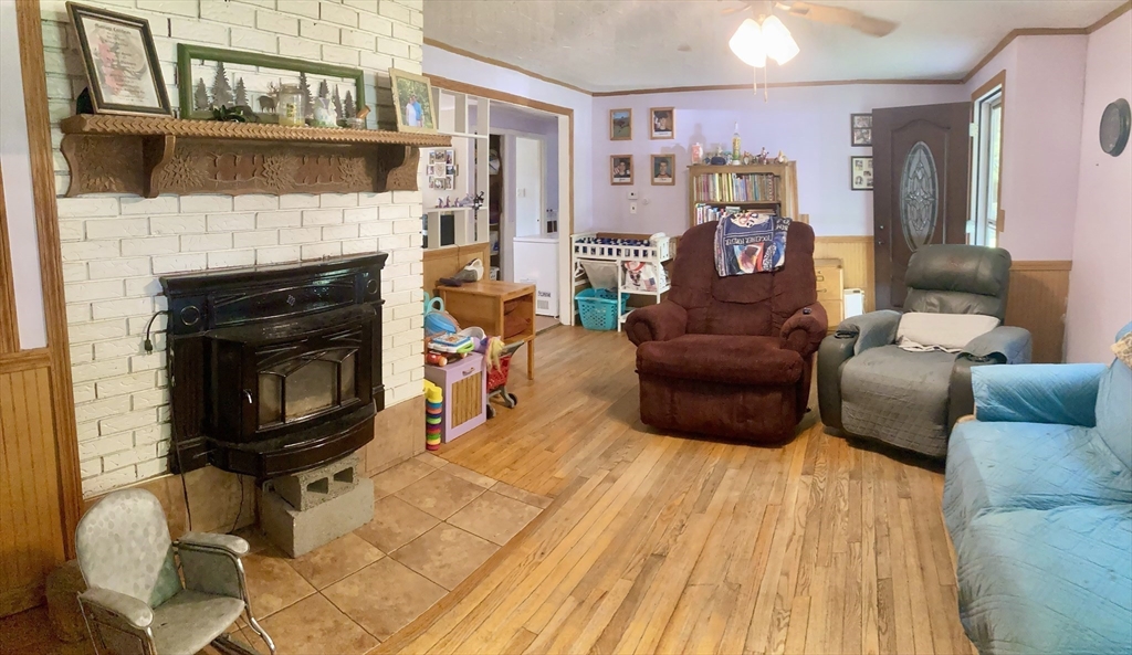 6 Kimball Hill Road Holland, MA 01521 - Photo 7 of 19 a living room with furniture and a fireplace