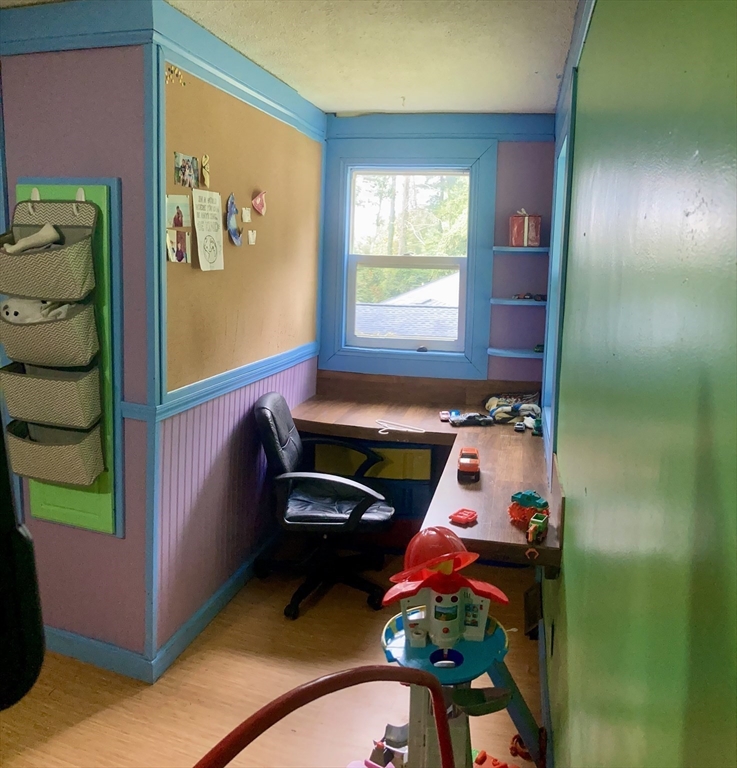 6 Kimball Hill Road Holland, MA 01521 - Photo 10 of 19 a room with painting on the wall and a potted plant