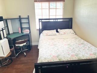 6075 Adriatic Way Greenacres, FL 33413 - Photo 12 of 24 a bed sitting in a bedroom next to a window