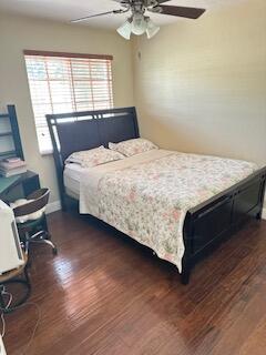 6075 Adriatic Way Greenacres, FL 33413 - Photo 13 of 24 a bed sitting in a bedroom next to a window