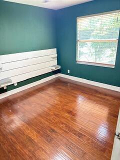6075 Adriatic Way Greenacres, FL 33413 - Photo 21 of 24 a view of empty room with window and wooden floor