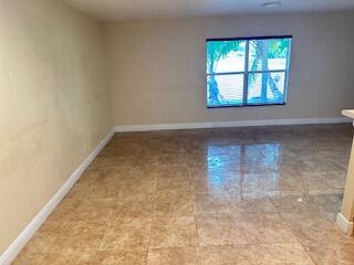 6075 Adriatic Way Greenacres, FL 33413 - Photo 6 of 24 an empty room with a window