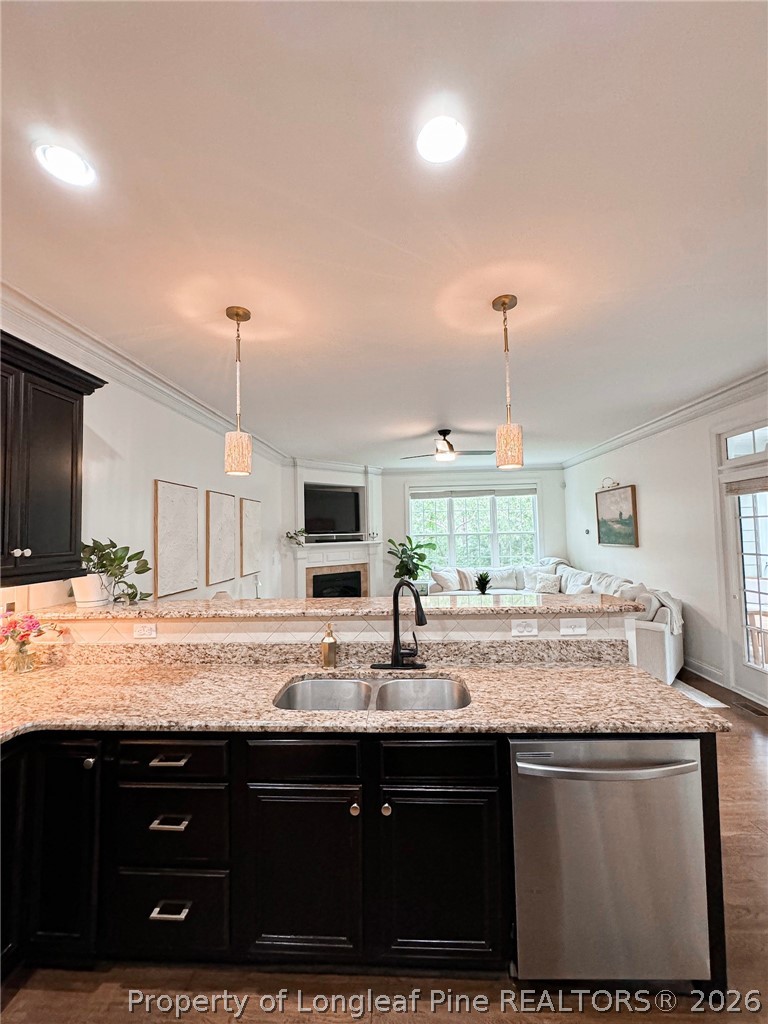93 Falcon Ridge Drive Spring Lake, NC 28390 - Photo 15 of 50 a kitchen with kitchen island granite countertop a sink cabinets and stainless steel appliances