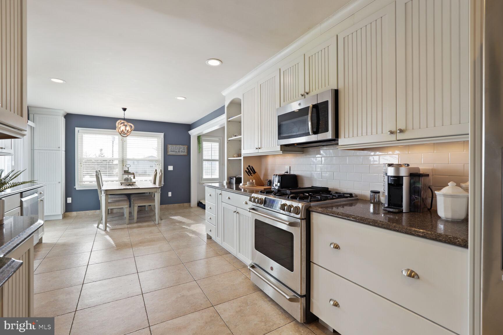 29 Walkill Road Tuckerton, NJ 08087 - Photo 13 of 35 a kitchen with stainless steel appliances granite countertop a stove a sink and a refrigerator