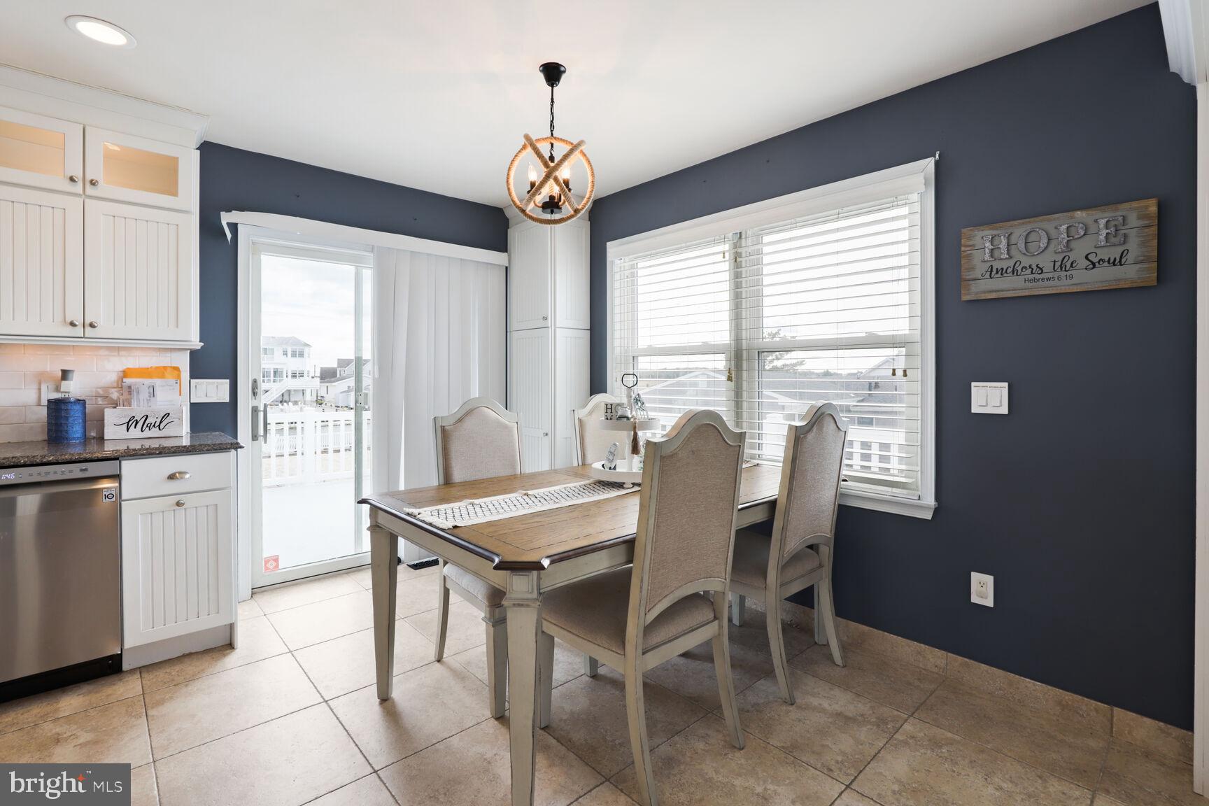 29 Walkill Road Tuckerton, NJ 08087 - Photo 16 of 35 a dining room with stainless steel appliances granite countertop furniture and a chandelier