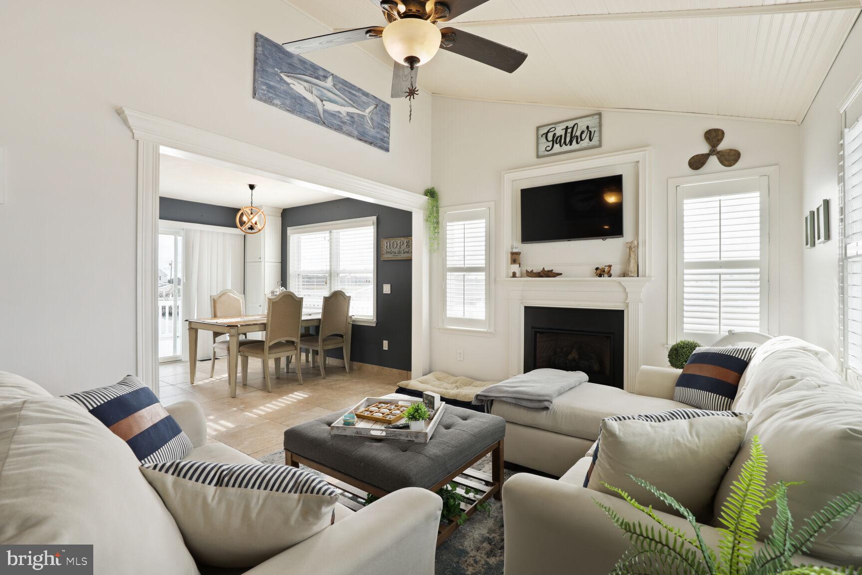 29 Walkill Road Tuckerton, NJ 08087 - Photo 17 of 35 a living room with furniture a flat screen tv and a fireplace