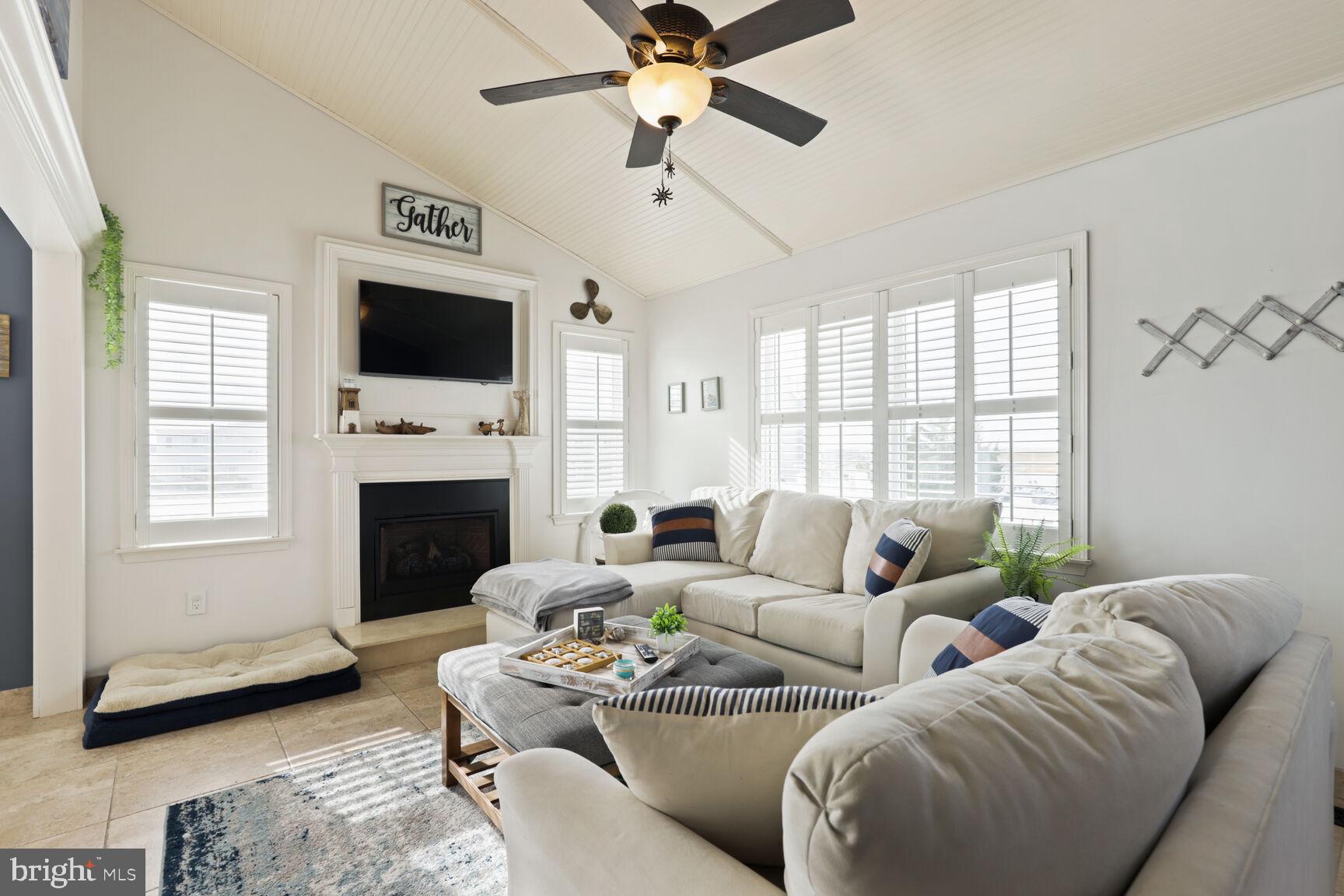 29 Walkill Road Tuckerton, NJ 08087 - Photo 18 of 35 a living room with furniture a flat screen tv and a fireplace