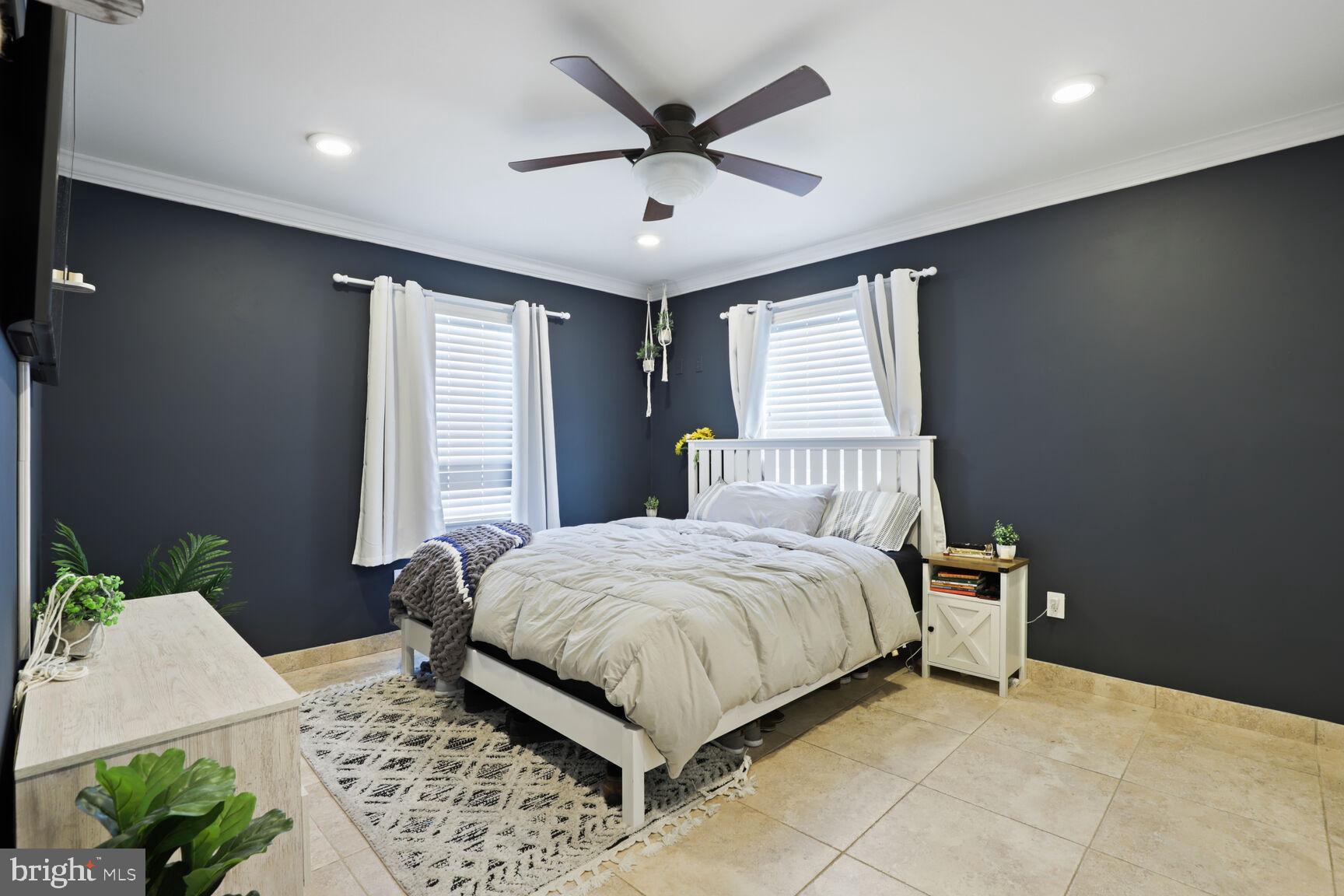 29 Walkill Road Tuckerton, NJ 08087 - Photo 22 of 35 a bedroom with a bed and a chandelier
