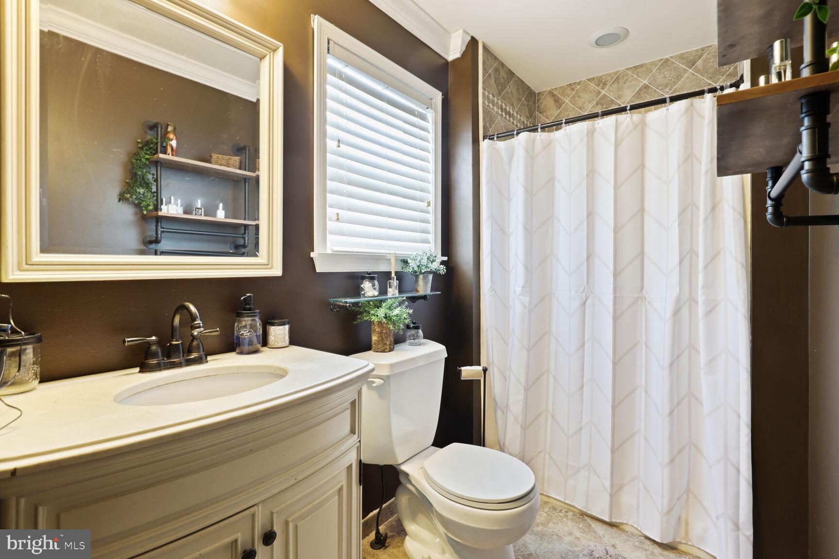 29 Walkill Road Tuckerton, NJ 08087 - Photo 24 of 35 a bathroom with a sink a toilet and a mirror