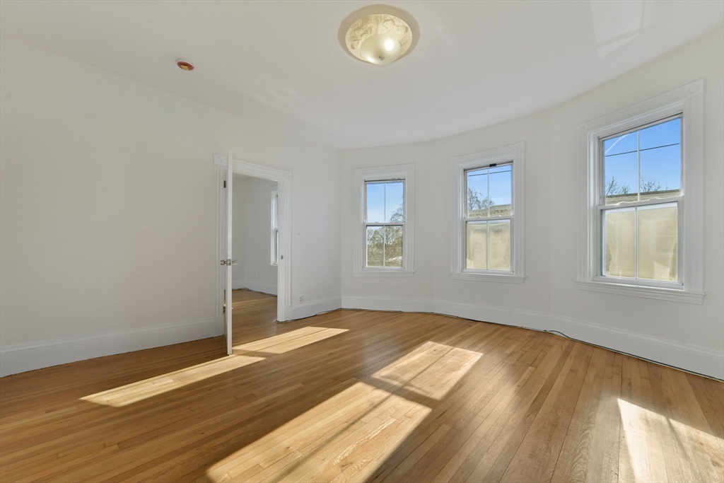 50 Mt Vernon Street, Unit 3 Boston, MA 02125 - Photo 1 of 16 a view of empty room with wooden floor and fan