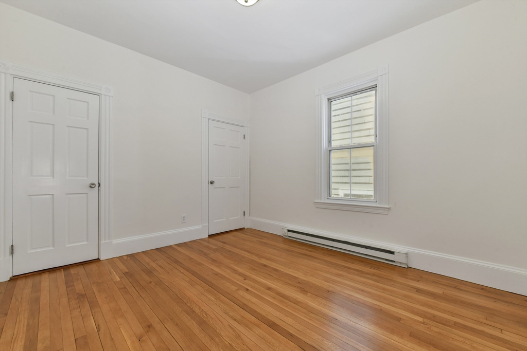 50 Mt Vernon Street, Unit 3 Boston, MA 02125 - Photo 11 of 16 a view of an empty room with wooden floor and a window