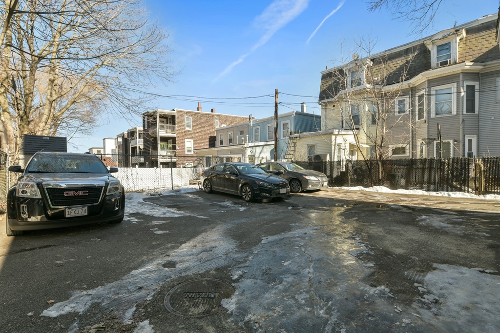 50 Mt Vernon Street, Unit 3 Boston, MA 02125 - Photo 16 of 16 a view of a street with a cars parked in front of it