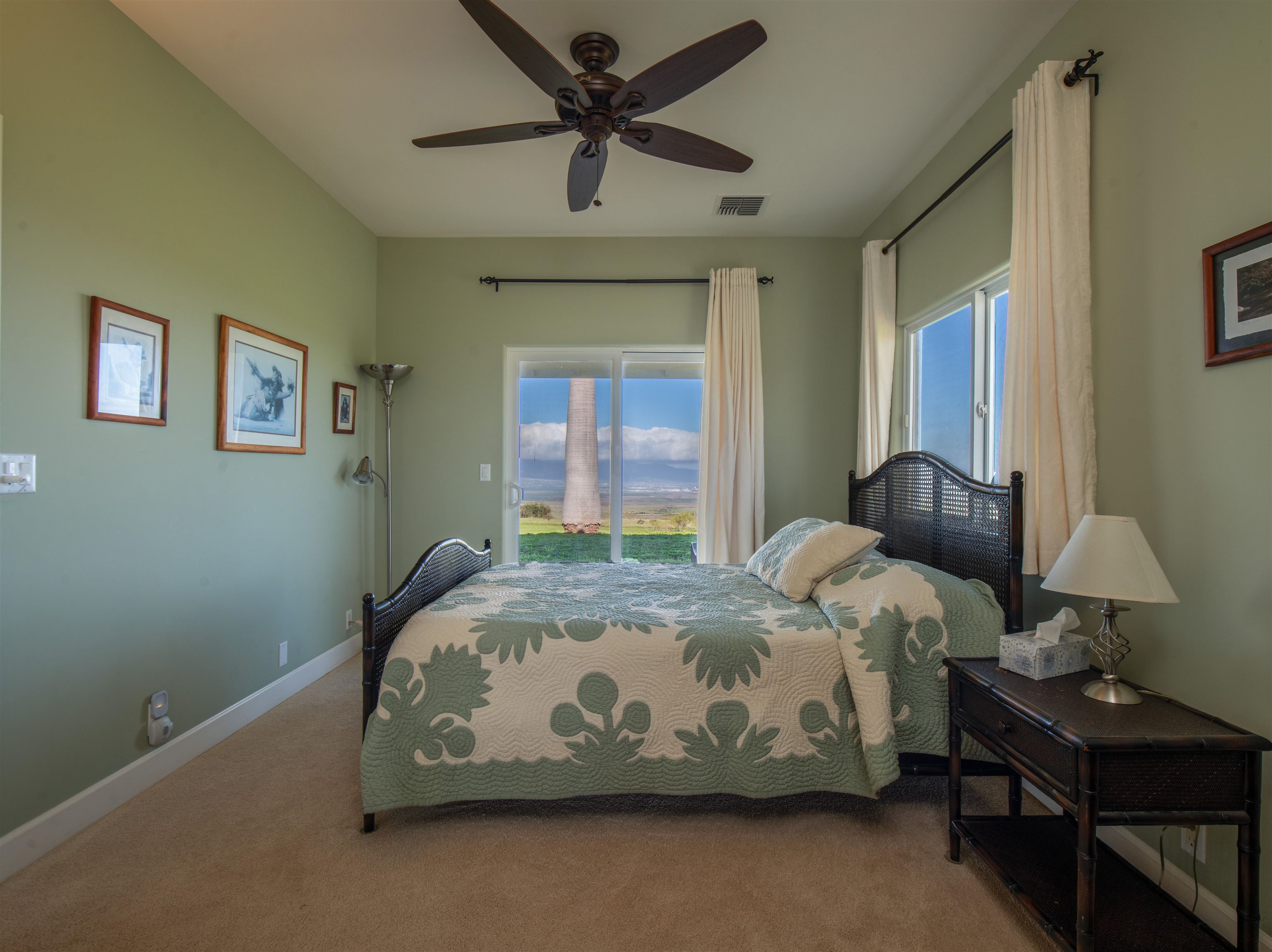 2345 Omaopio Road Kula, HI 96790 - Photo 11 of 23 a bedroom with a bed and window