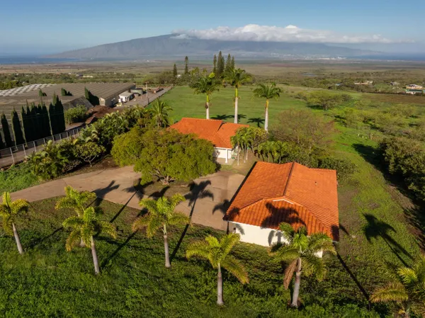 an aerial view of ocean with residential house and ocean view