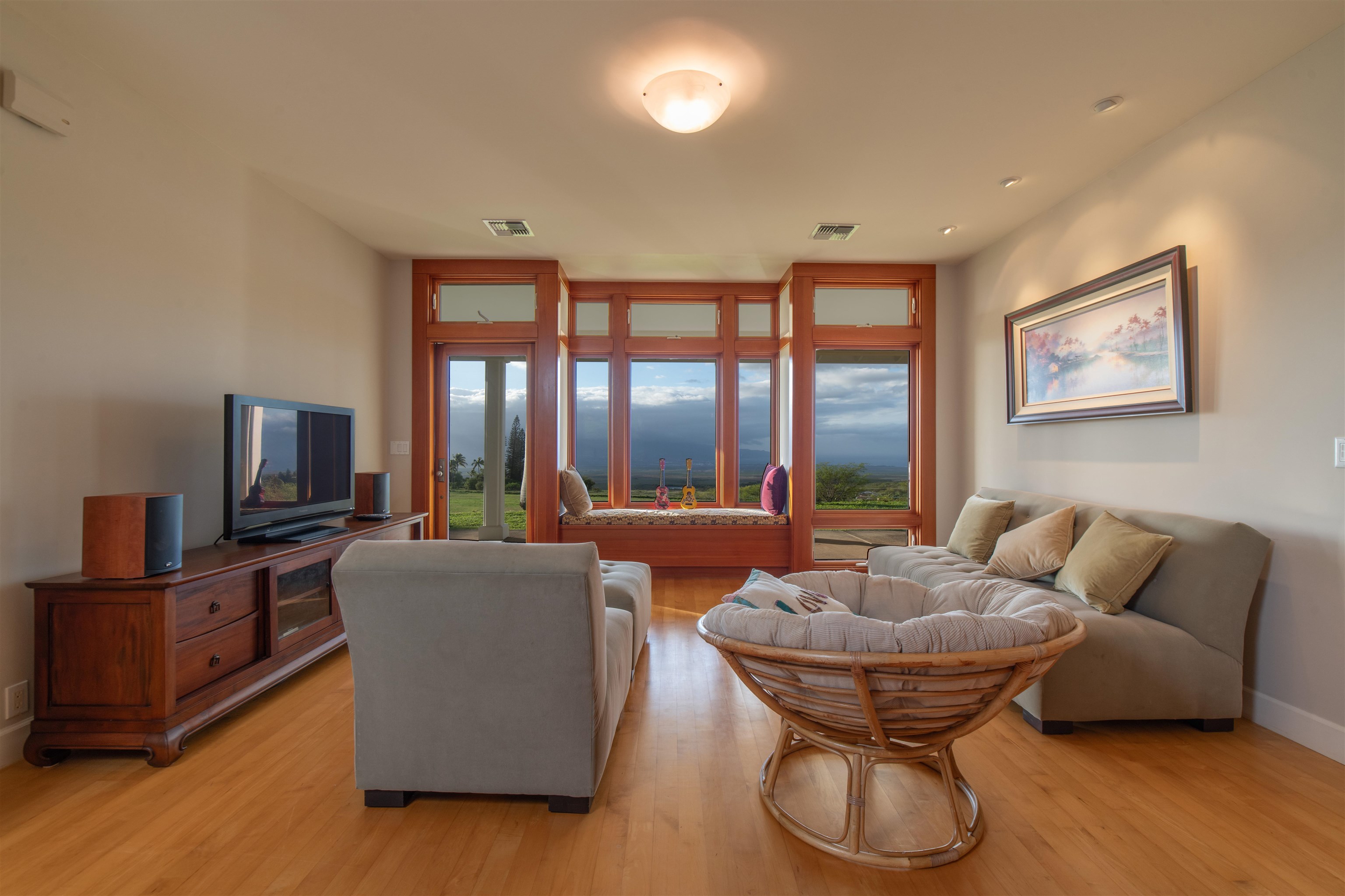 2345 Omaopio Road Kula, HI 96790 - Photo 6 of 23 a living room with furniture and a flat screen tv