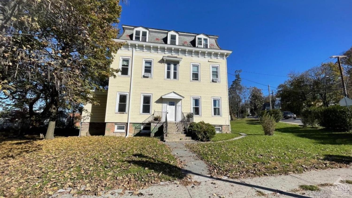 834 Warren Street, Unit 7 Hudson, NY 12534 - Photo 8 of 9 a view of a white building with a yard