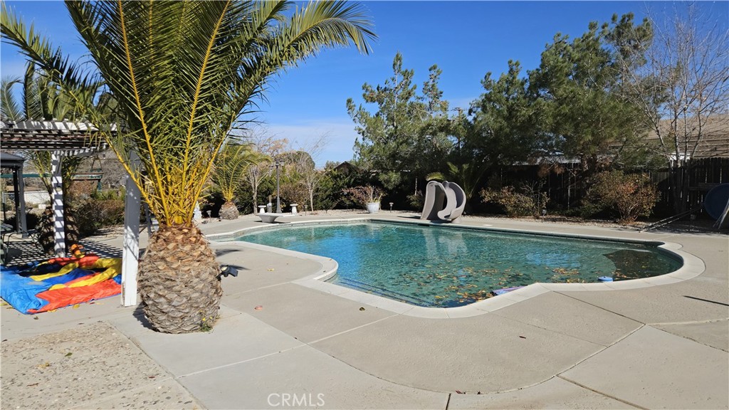 15274 Rodeo Street Hesperia, CA 92345 - Photo 11 of 43 a view of outdoor space yard and swimming pool